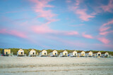 Fototapeta Tulipany - Row of rentable tiny homes along the dutch sea coast