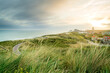 Coastline with a view over the dunes and the seaside resort of Domburg at sunset