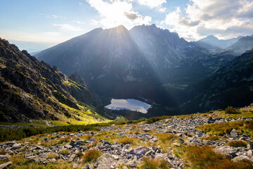 Wall Mural - sunshine over mountain lake