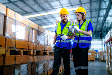 workers using Laser Barcode Scanner to checking stock items for shipping. male and female inspecting the store factory. industry factory warehouse. Logistics employees working at warehouse management.