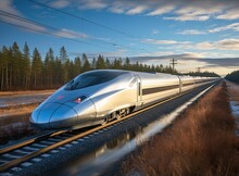 A High-speed Passenger Train Of Class X Effortlessly Races Along The Railway, Cutting Through The Landscape With A Sense Of Dynamic Motion. The Surrounding Scenery Unfolds In A Blur As The Train Zips