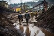 A group of workers trekking through a muddy quarry road