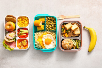 Sticker - Lunchboxes with different delicious food on light background