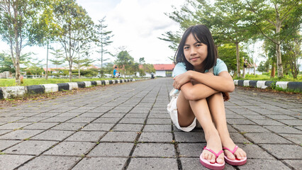 little girl in a beautiful park