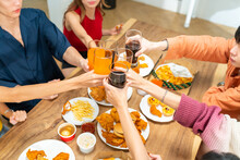 Group Of Young Asian Man And Woman Friends Having Dinner Party Eating Food And Drinking Soft Drink Together At Home. Happy People Friends Have Fun Reunion Meeting Celebration Party On Holiday Vacation