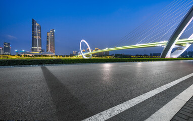 Canvas Print - Asphalt road and bridge buildings with city skyline scenery in Nanjing, China.