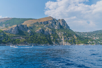 Wall Mural - The Amalfi Coast is a breathtaking stretch of coastline in southern Italy, known for its vertiginous cliffs adorned with colorful villages, turquoise waters, and lush terraced gardens. Its beauty capt