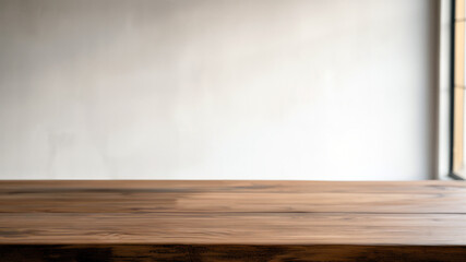 Wall Mural - Empty brown wooden table against a blurred white wall with a window. Ideal for product display. High quality photo