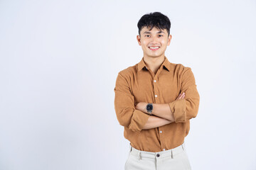 Wall Mural - Photo of young Asian businessman on white background