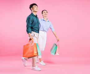 Canvas Print - Photo of young Asian couple on background