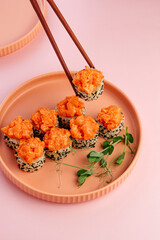 Wall Mural - japanese sushi rolls with a shrimp cap on a plate