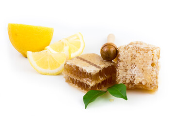 Wall Mural - sweet honeycombs with lemon isolated on white background