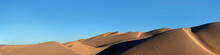 Horizontal Panorama Desert Sand Dunes And Blue Sky