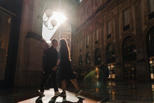 Young Stylish Man And Woman In Vittorio Emanuele Gallery In Milan