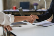 © ArLawKa - holding hands during job interview The applicant shakes hands with the interviewer or employer after the job interview. Hiring and recruiting concepts close up pictures