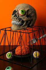 Wall Mural - Table setting for Halloween, scary decorations with a skull