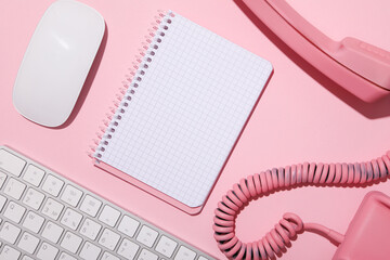 Wall Mural - Vintage phone, keyboard and notepad on pink background, top view