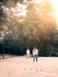 © Boscaeta - a couple playing petanque in a park