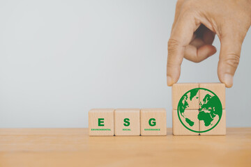 ESG text on wooden cube block with copy space. For environmental, social and governance. Sustainable corporation development concept