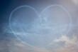 The shape of a heart written in the sky by acrobatic pilots