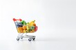 © Miftah - shopping trolley full of fruit and vegetables copy space white background ai generative