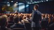 © saranya - businessmen and businesswomen in conference room, listening to the speakers which is on stage attentively