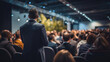© saranya - businessmen and businesswomen in conference room, listening to the speakers which is on stage attentively