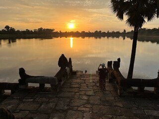 Wall Mural - Sunrise seen from an artificial pond built for the king's ablution, Srah Srang, Angkor ruins, Siem Reap, Cambodia