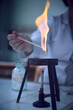 Glass equipment sterilisation in the flame of burner. Bunsen burner, tripod in the chemical laboratory.