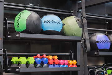 Wall Mural - Colorful Fitness Medicine Balls and other Equipment inside Gym