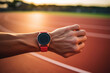 Hand Of Sportsman With Smart Watch On Running Track