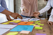 © Wasan - Meeting of colleagues is discussing marketing strategy analysis and planning to achieve business goals.