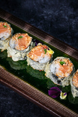 Wall Mural - Yummy salmon tempura rolls served on plate in Japanese restaurant