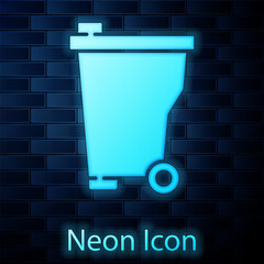 Poster - Glowing neon Trash can icon isolated on brick wall background. Garbage bin sign. Recycle basket icon. Office trash icon. Vector