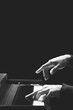 © princeoflove - closeup male pianist hands playing piano, isolated on black. black and white. music background
