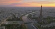 Beautiful view of famous Eiffel Tower in France with colorful twilight romantic sky. Wide establishing aerial morning sunrise or sunset of paris city center best travel destinations landmark in Europe