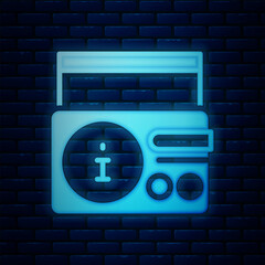 Sticker - Glowing neon News on radio channel icon isolated on brick wall background. Vector