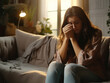 © Kedek Creative - Young female covering face with hands while crying alone at home