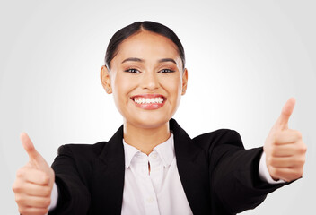 Wall Mural - Happy woman, portrait and thumbs up in business success, winning or thank you against a studio background. Face of female person or employee smile in like emoji, yes sign or OK agreement and approval