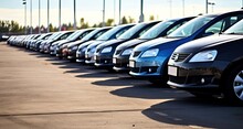 A Vast Stock Lot Filled With A Variety Of Cars For Sale, Lined Up In Neat Rows. This Image Captures The Diversity And Abundance Of Choices Available At The Car Dealership.