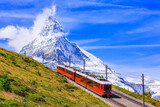 Fototapeta Uliczki - Zermatt, Switzerland. Gornergrat tourist train with Matterhorn mountain in the background. Valais region.