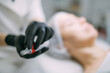 © Anna - Cosmetologist and dermatologist makes injections with a mesotherapy apparatus to a lying woman patient in a beauty salon.