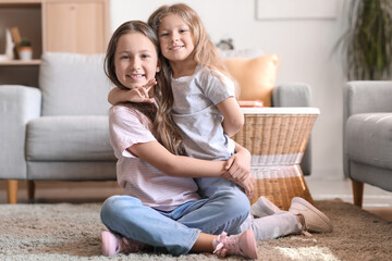 Poster - Cute little sisters hugging at home