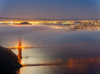 Wall Mural - Twilight aerial view of the Golden Gate Bridge with fog