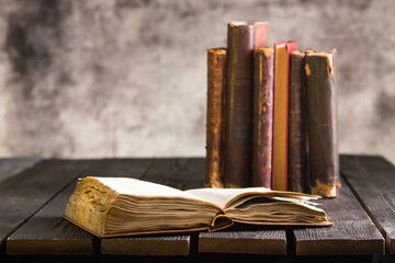 Wall Mural - Open book, hardback books on wooden table. Back to school. Copy space	