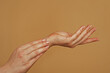 © Volodymyr - Reaching touching hands. Reach hand. Sensual touch. Beautiful Woman Hands. Female Hands Applying Cream, Lotion. Spa and Manicure concept. Female hands. Soft skin, skincare concept. Hand Skin Care.
