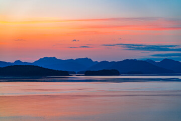 Wall Mural - landscape of mountain, island in sea with amazing sunset with dramatic color sky
