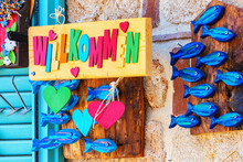 Colorful Wall Of The Gift Shop With Welcome Note, Wooden Figurines Of Blue Fishes And Hearts. Aug 11, 2022. Side, Turkey