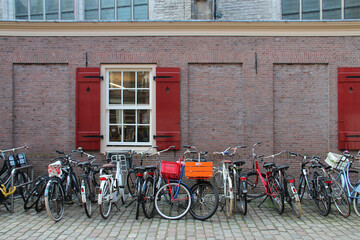 Wall Mural - old brick house and bicycles in amsterdam (netherlands)