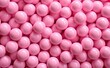 Leinwandbild Motiv Lot of bright Pink blusher balls as a background.